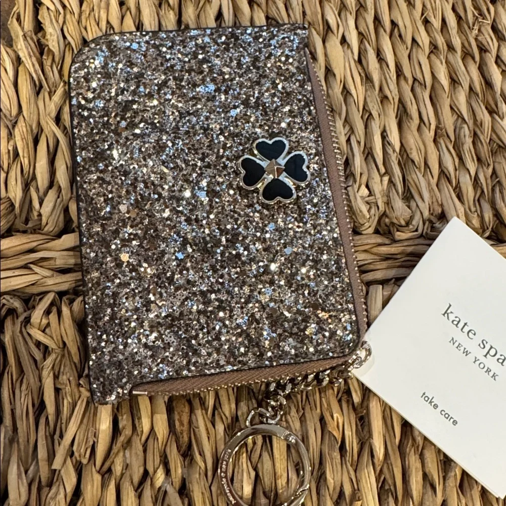 Kate Spade glitter clutch wristlet in gold and black